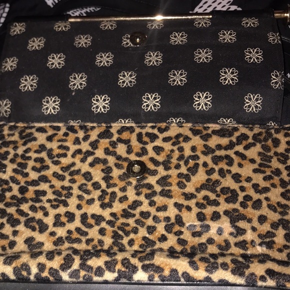 Black with gold tone hardware and faux leopard fur accents. Purse - Picture 2 of 5